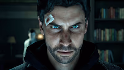 A close-up portrait of the video game character Alan Wake looking intensely at the camera, with striking bright blue eyes and a blood-stained bandage on his forehead.