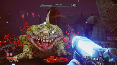 Defeated Chaos Sorcerer helmet rests in a pool of blood next to the player's smoking boltgun pistol in Warhammer 40,000: Boltgun.